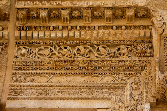 Intricate carved friezes with rosettes and vine scrolls decorate the ancient Roman temple ruins, Baalbek-Hermel Governorate, Baalbek, Lebanon