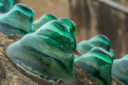 Rows of traditional green glass roof tiles from the historic Ezzeddine Hammam catch the light in close-up detail, North Governorate, Tripoli, Lebanon