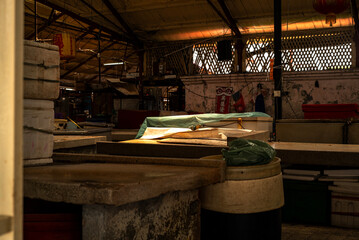 Dimly Lit Interior of Traditional Wet Market Stalls © KL