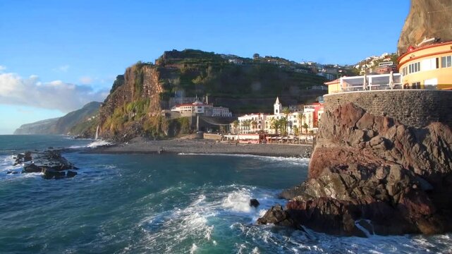Ponta do Sol is a picturesque coastal village on Madeira Island, Portugal at sunset. Dramatic cliffs, volcanic rocks, and the Atlantic Ocean create a stunning landscape.