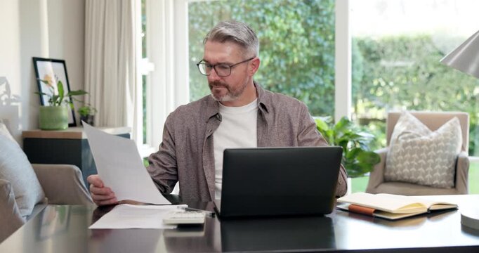 Remote work, paper and man in home office with laptop, forecast and growth plan in finance review. WFH, digital or mature advisor with document, budget outlook or reading report on revenue projection
