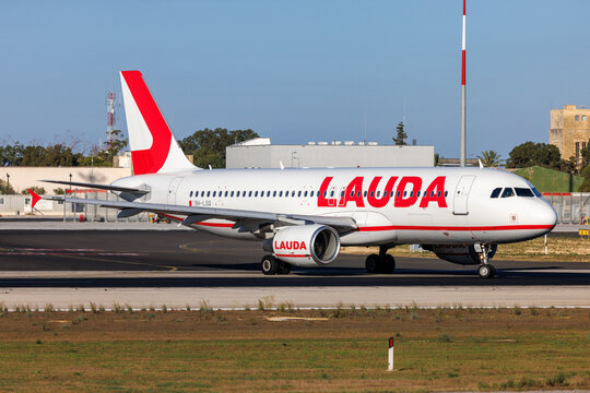 Luqa, Malta - September 16, 2026: Lauda Europe Airbus A320-214 (REG: 9H-LOQ) on taxiway Golf, for take off from runway 13 as flight FR1589 to Vienna (VIE).	