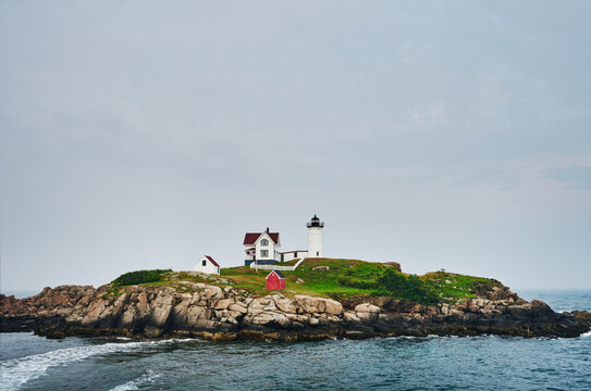 the iconic Cape Neddick Lighthouse (built 1879), also known as Nubble Light, located on a small rocky islet off the coast of York, Maine, New England