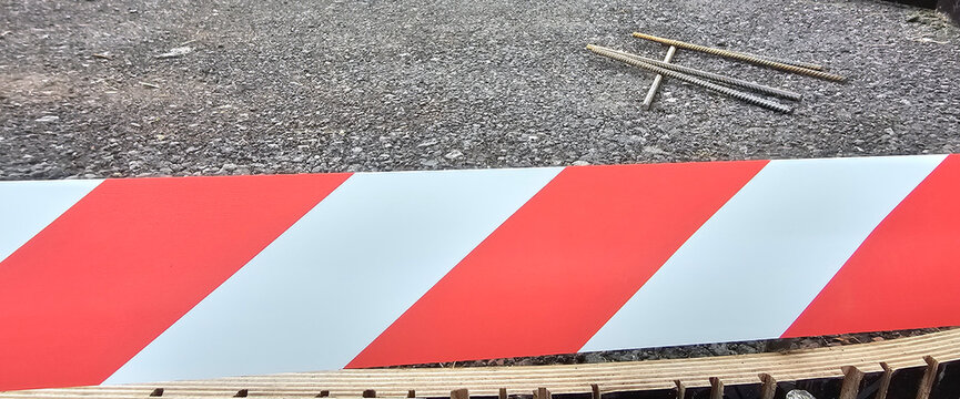 Construction area marked with red and white barricade