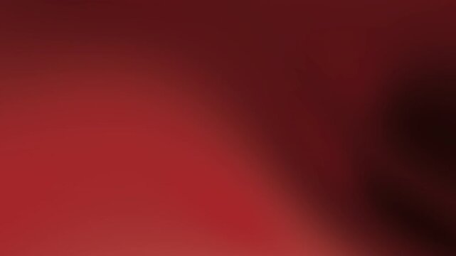 Abstract red background gradient texture with grainy film burn and cinematic warm glow