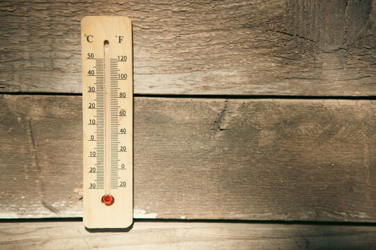 Thermometer on wood background - vintage effect style pictures.