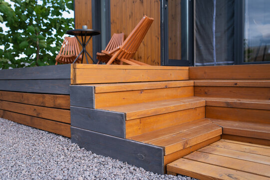 natural wooden steps and decking, highlighting texture, durability exterior wood surfaces. Outdoor wood protection, wood stains and oils, protective coating, weatherproofing, wood maintenance, decking