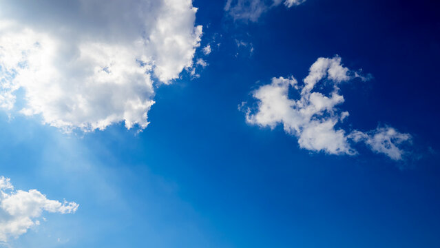 white cloud on the right against bright azure sky