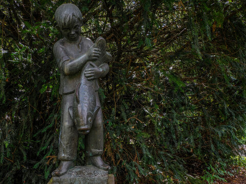 Bronze Boy Holding Fish Sculpture Grimm Brothers Marburg Germany
