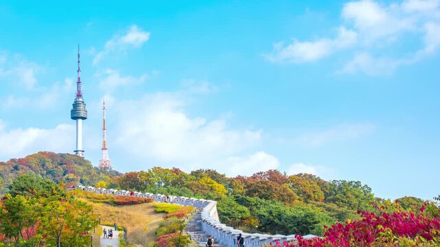 4K Time lapse of beautiful autumn season in Seoul city South Korea with clear blue sky and moving clouds and colorful fall foliage trees in outdoor.