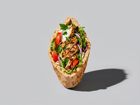 Stuffed Pita Sandwich with Grilled Meat Isolated on Light Grey Background