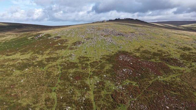 Dartmoor landscape drone view up to a tor