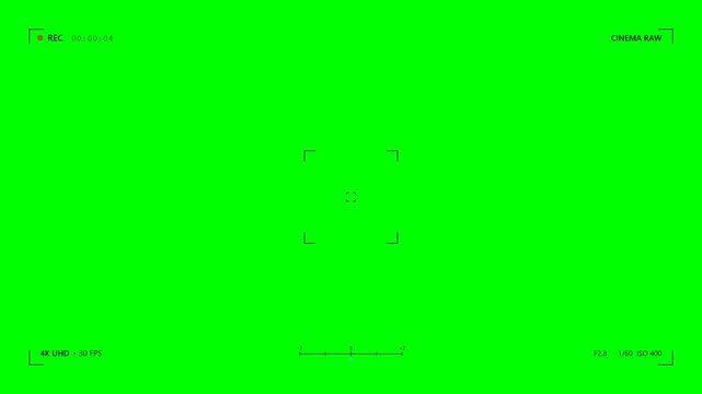 Camera recording overlay with animated focus tracking, REC indicator, and exposure meter. Rendered on a solid green background.