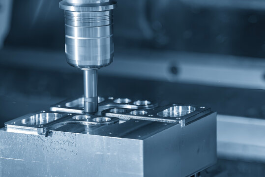 Parts deburring process on a CNC milling machine using a chamfer tool in a blue tone scene