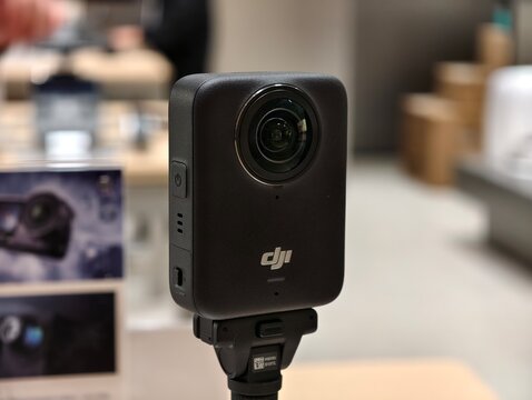 Shanghai,China-Dec.27th 2025: Close-up view of a DJI Osmo 360 action camera mounted on a grip