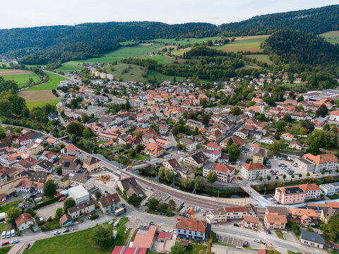 Cozy village nestles among green hills