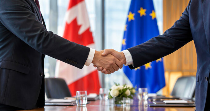 Canadian and European Union officials shaking hands in front of their respective flags during a formal diplomatic summit for trade and cooperation.