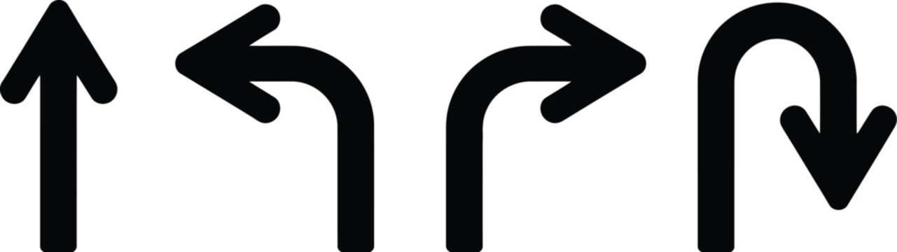 Traffic arrows, black road signs showing straight ahead one way U turn left and right directions for traffic navigation and guidance.