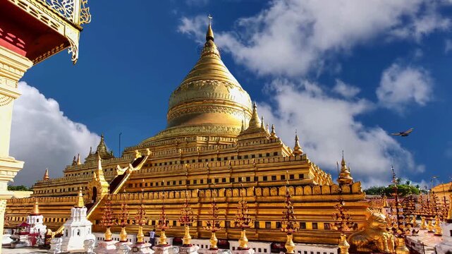 Bagan, Myanmar - March 15: Novice Buddhist monks walking around the sacred Shwezigon Paya, one of Myanmar's most revered pagodas, in Nyaung U, Bagan, Myanmar (Burma).BAGAN Burmese womans visit Shwezig