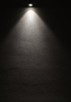black and white neon light bulb on concrete wall. Background texture of empty new modern cement in plaster wall with glowing led lamp. night scene. empty copy space for inscription.