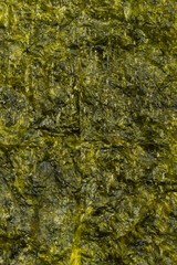 Tasty nori seaweed as a background. Top view. © Nikolay