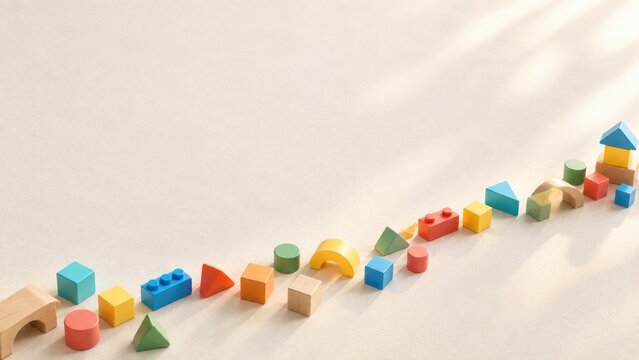 Colorful Educational Building Blocks and Geometric Shapes Arranged on Neutral Background