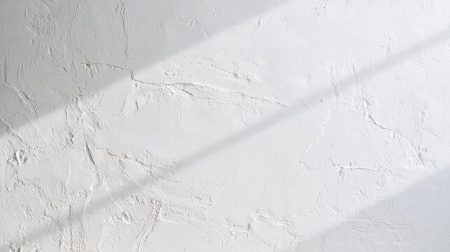 Bright white plaster surface with irregular texture and subtle tonal variation