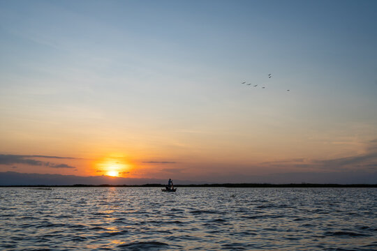 Boat at sunset on Lake Tempe, Sulawesi, Indonesia