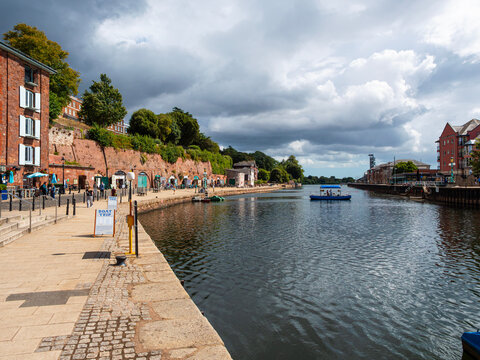 The River Exe flows through historic Exeter Quay, a popular waterside leisure and heritage location in Devon. The Butts Ferry takes passengers across the river to Haven Banks. 