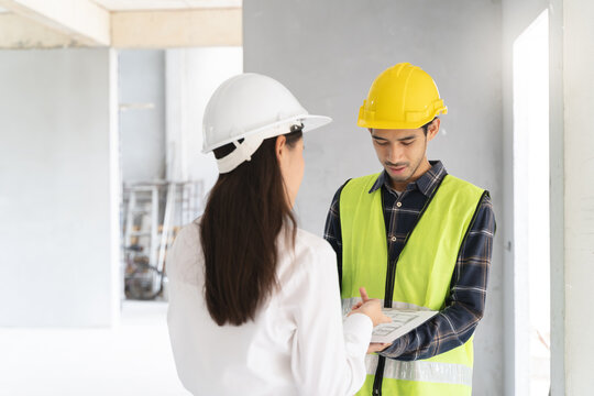 Client and Contractor discussing plan to renovation house