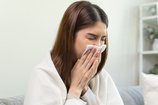 Female unhealthy Sickness, asian young woman, girl unwell and coughing, have cold, sore throat isolated white background suffering with symptom cough feeling bad. Healthcare of Coronavirus, covid-19.