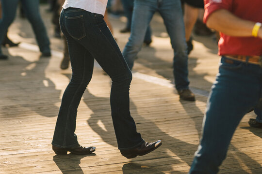 Line Dance Group Moving in Formation on Boardwalk