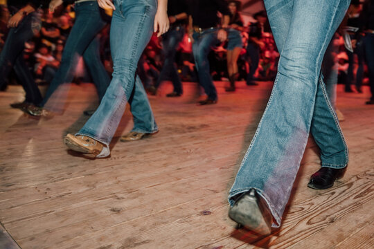 Pair of Dancers in Denim Moving in Motion Blur