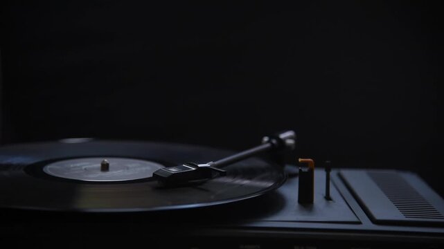 Turntable spinning vinyl record. Closeup of old gramophone playing retro music. Analog audio sound technology. DJ musical equipment, vintage groove, 