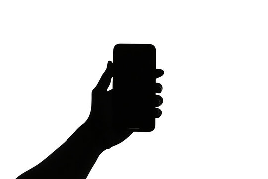 Black silhouette of hand holding smartphone