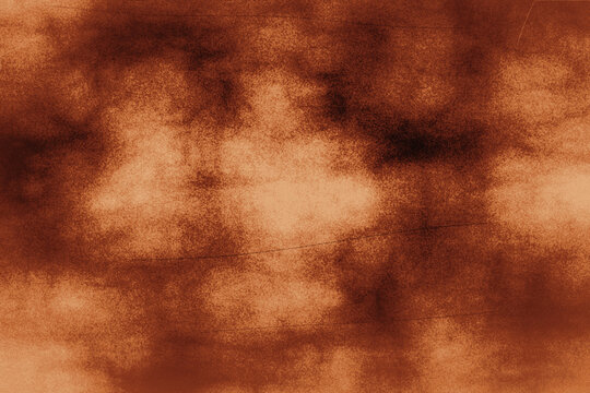 Abstract brown grunge texture background with scratch marks and dark spots creating vintage rustic aesthetic ideal for digital design backdrops.