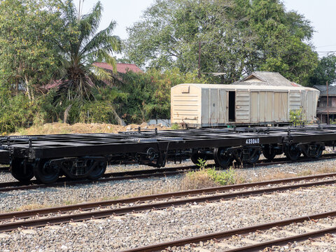 Empty Flatcar Wagon on Railway Tracks