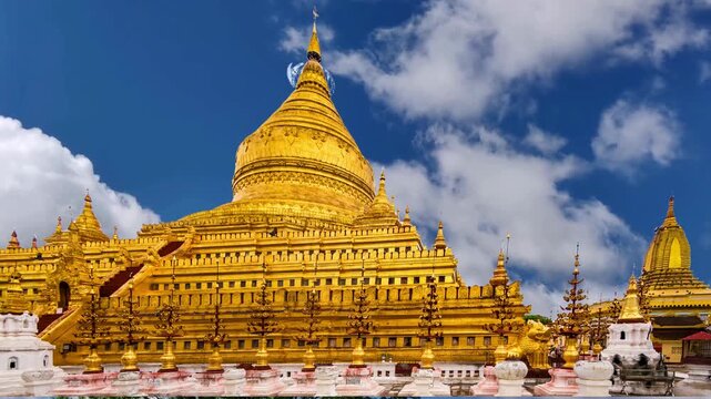 Title: Bagan, Myanmar - March 15: Novice Buddhist monks walking around the sacred Shwezigon Paya, one of Myanmar's most revered pagodas, in Nyaung U, Bagan, Myanmar (Burma).BAGAN Burmese womans visit 