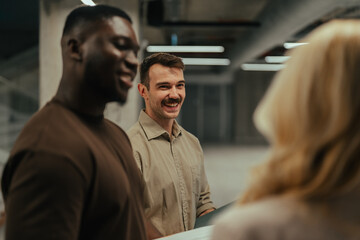 Fototapeta premium Diverse business colleagues collaborating and smiling in office