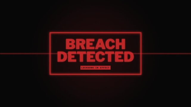 Cyber security breach detected alert with lockdown in effect message on dark screen.