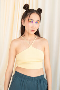Young Asian female model with colorful makeup