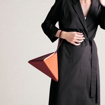 Elegant Black Trench Coat With Statement Bag