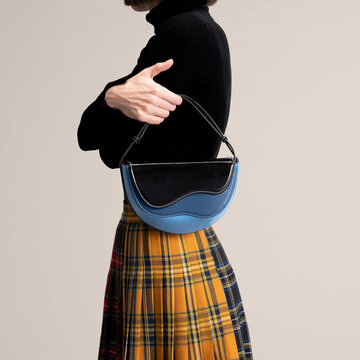 Black Handbag and Tartan Skirt Fashion Detail