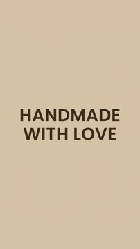 Minimalist vertical animation of handmade with love text with digital glitch reveal effect on beige background.