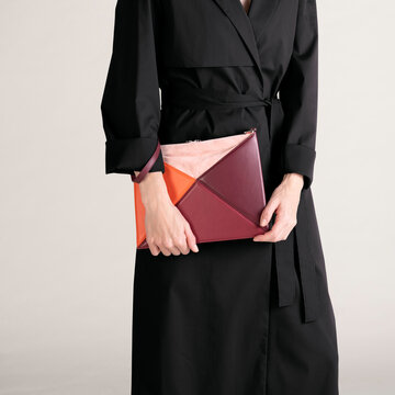 Minimal Black Coat With Colorblock Clutch