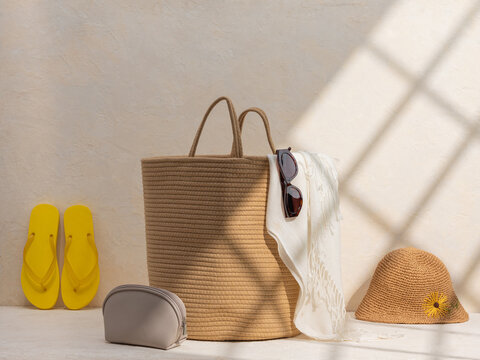 Beach Vacation Essentials on texture background with sunlight
