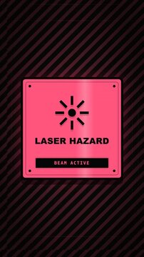 Animated pink laser hazard warning sign with active beam notification on striped background.