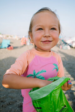 Happy Toddler Reaching Into a Snack Bag