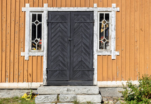 Old doors of wooden abandoned building