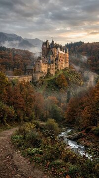 Eltz Castle in autumn forest landscape with stream